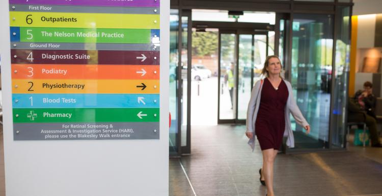 Woman entering hospital