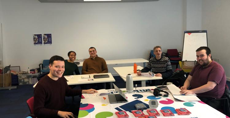 Left to right is our community connectors are Patrick, Chloe, Alexander, Doug and Daniel, at their training event 