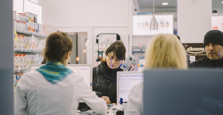 lady standing at a pharmacy