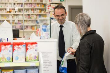 Pharmacist helping a customer
