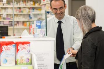 Pharmacist with patient