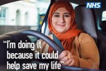 NHS Cervical screening campaign with smiling Muslim woman driving