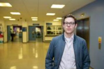 Young man in hallway