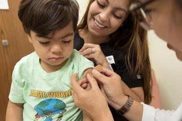 Young child receiving a vaccination