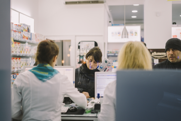 lady standing at a pharmacy