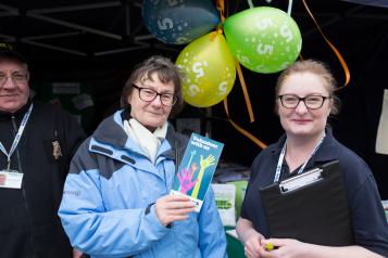 Volunteer speaking to a member of the public at an event