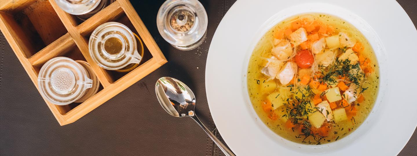 Vegetable Soup in a white bowl on dining table