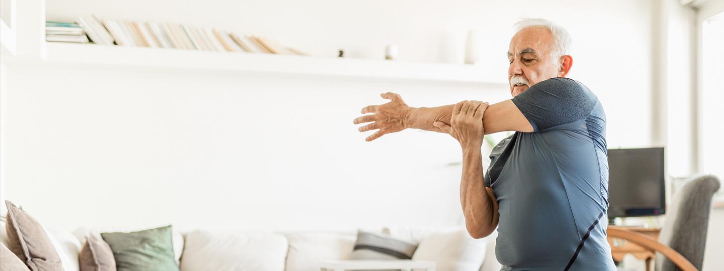 Older White Man Exercising at Home