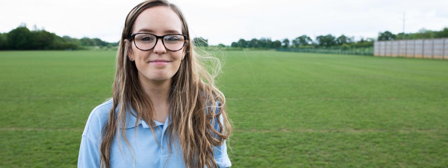 Young volunteer smiling at the camera