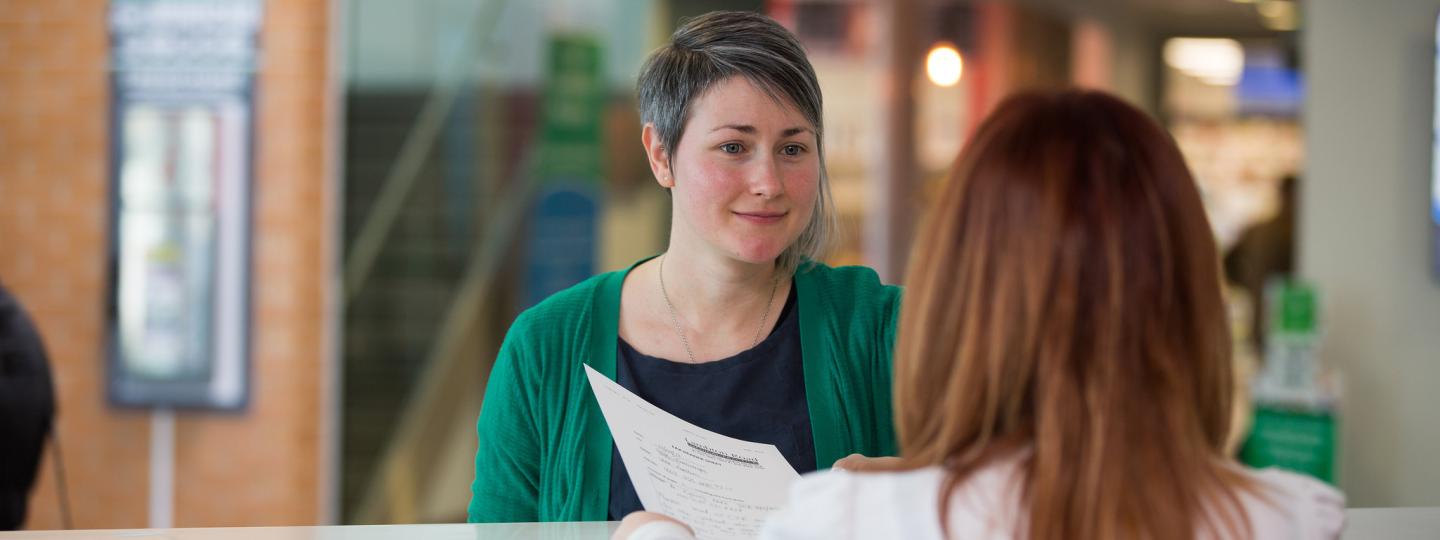 Lady at reception in a health service