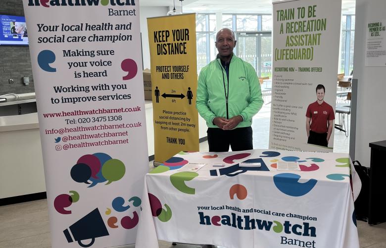 Healthwatch Barnet representative at Stay Well event with banner